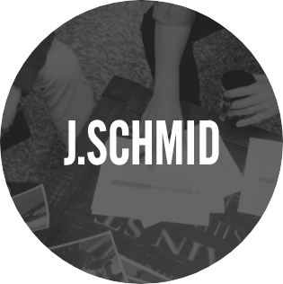 J.Schmid logo inside dark circle